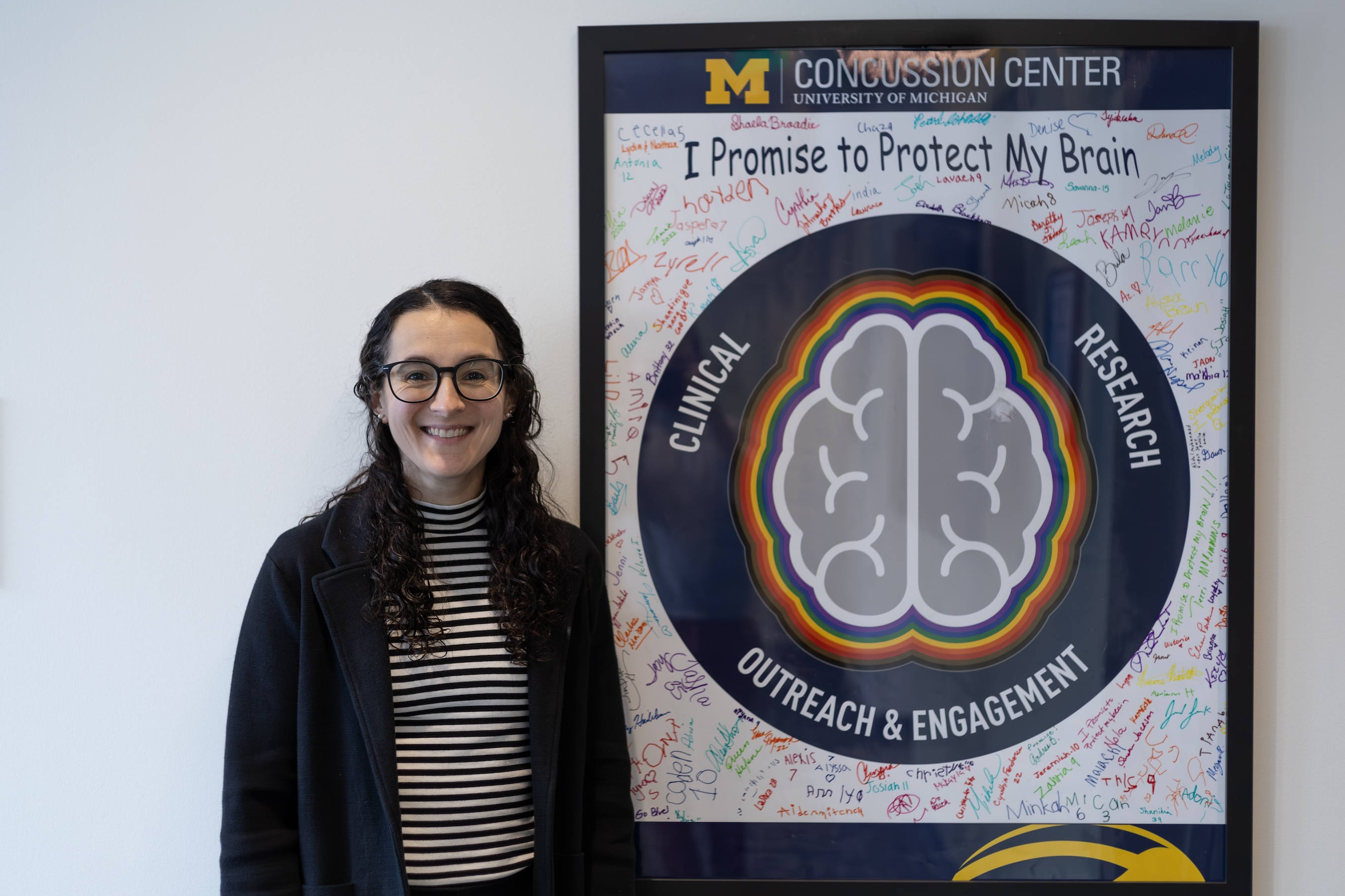Eleanna Varangis with a Concussion Center sign