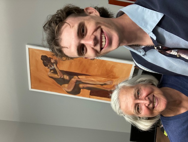 Borer in her office with her grandson and a painting he completed