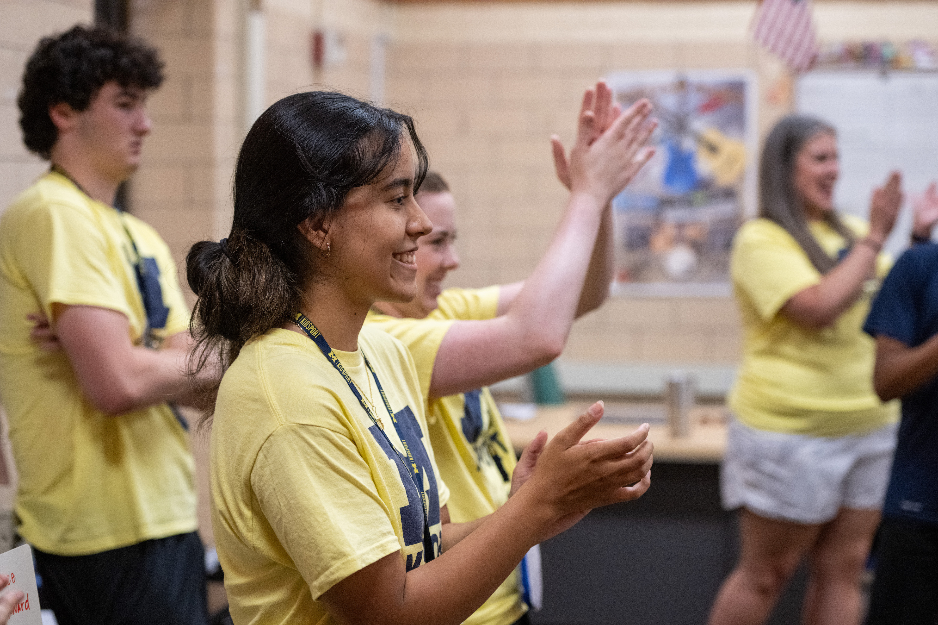 KidSport Adaptive counselor Ana Wong claps for the campers.