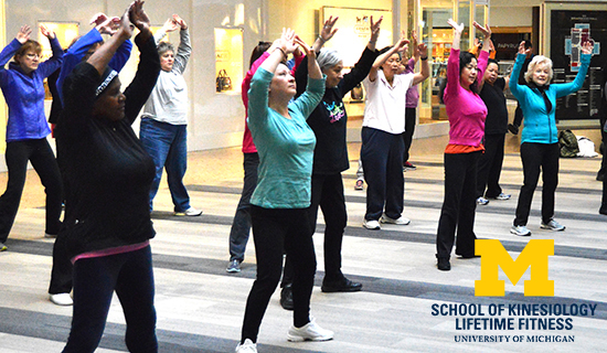 Senior adults exercising together