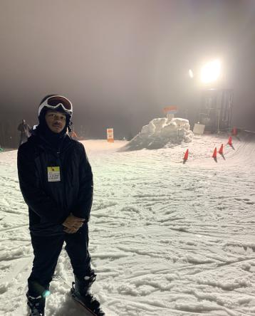 Austin Williams on skis on a snowy hill