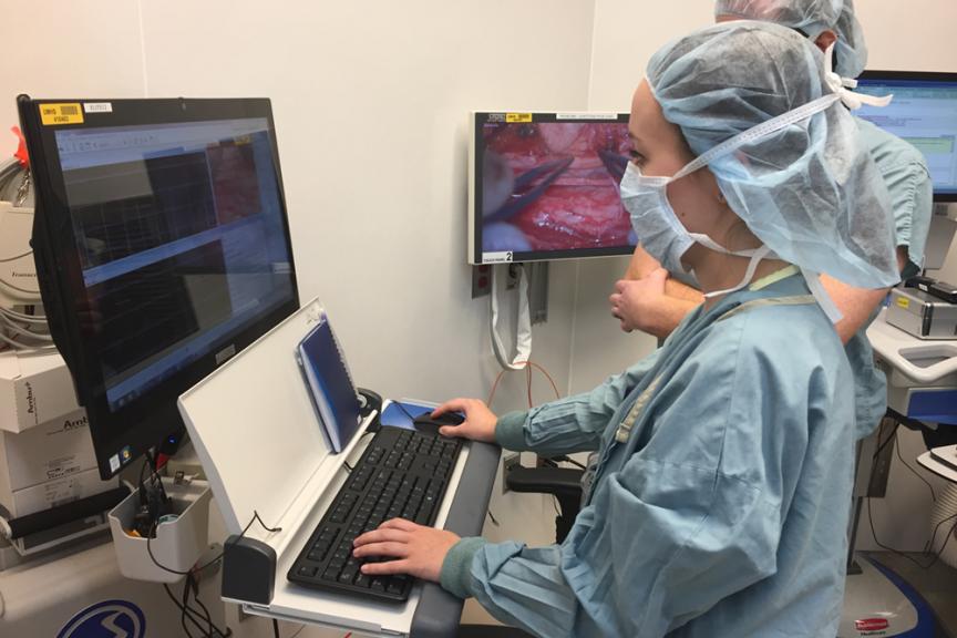 An IONM student and preceptor in the operating room