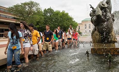 Orientation students going through the fountain