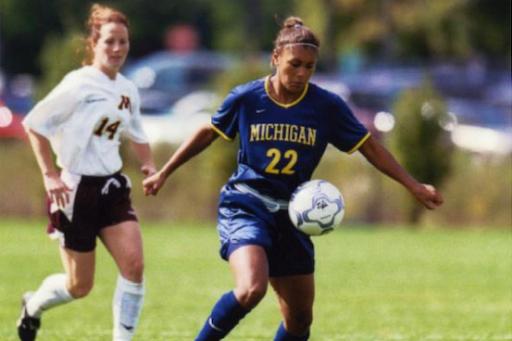 Abby Minihan playing soccer at the University of Michigan in the 2000s