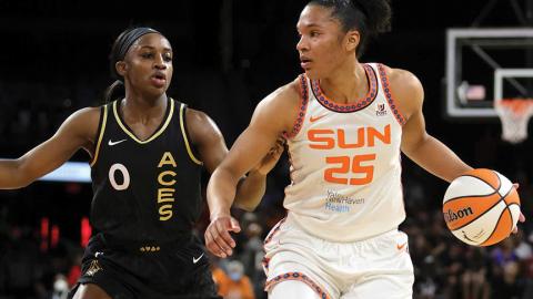 Two WNBA players guarding each other