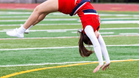 Cheerleader doing a back handspring