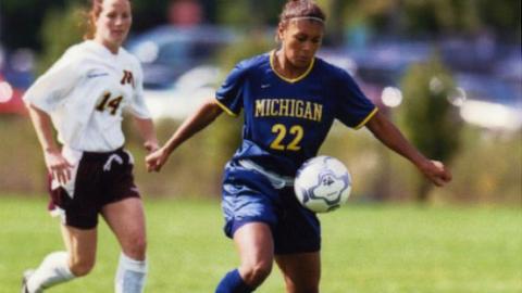 Abby Minihan playing soccer at the University of Michigan in the 2000s