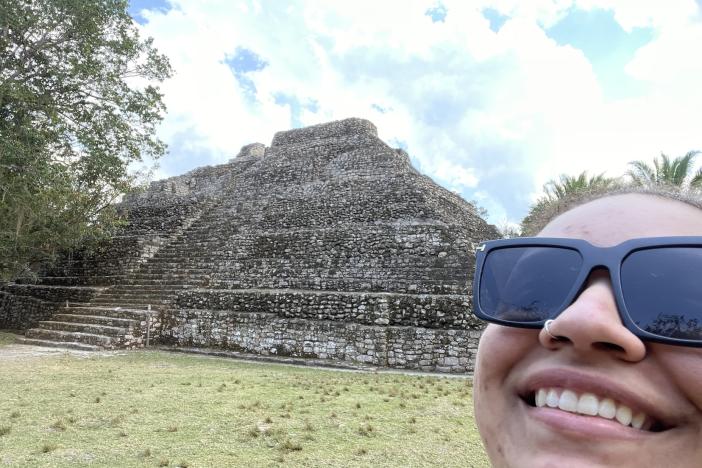 Brooke Stevens next to a temple